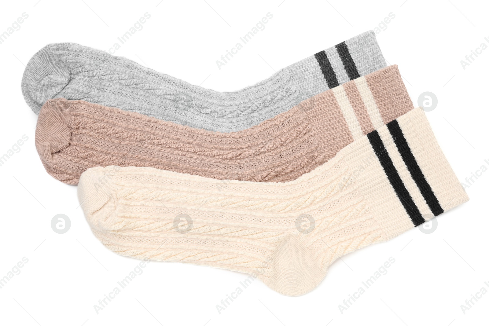 Photo of Different soft socks isolated on white, top view