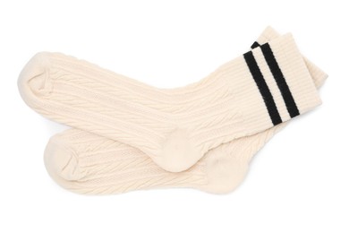 Photo of Pair of soft socks isolated on white, top view