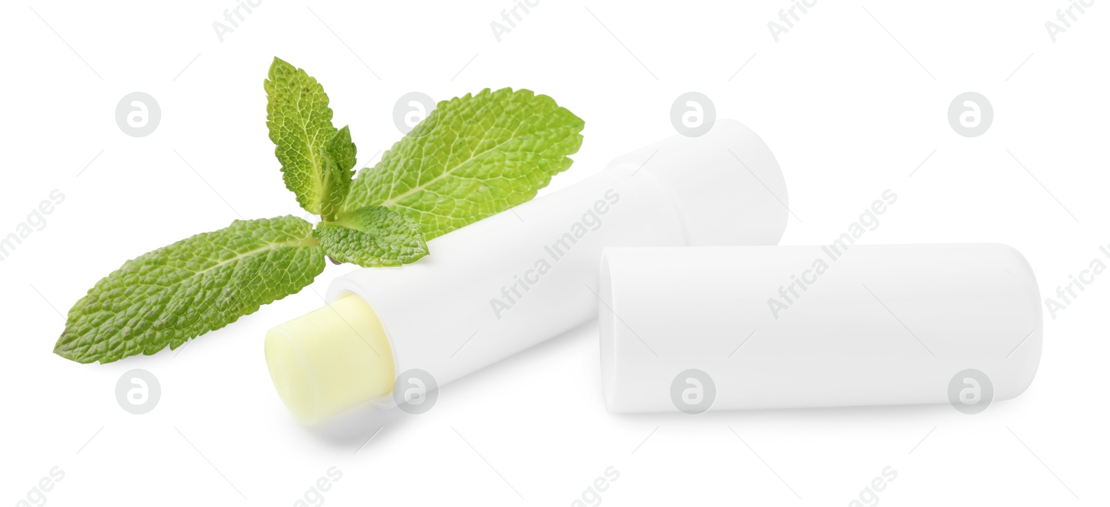 Photo of Mint lip balm and green leaves isolated on white. Cosmetic product