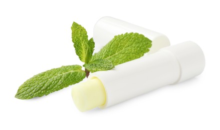 Photo of Mint lip balm and green leaves isolated on white. Cosmetic product