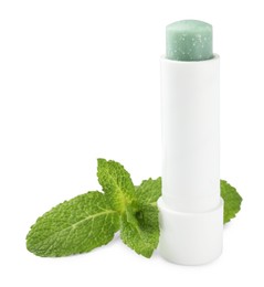 Photo of Mint lip balm and green leaves isolated on white. Cosmetic product