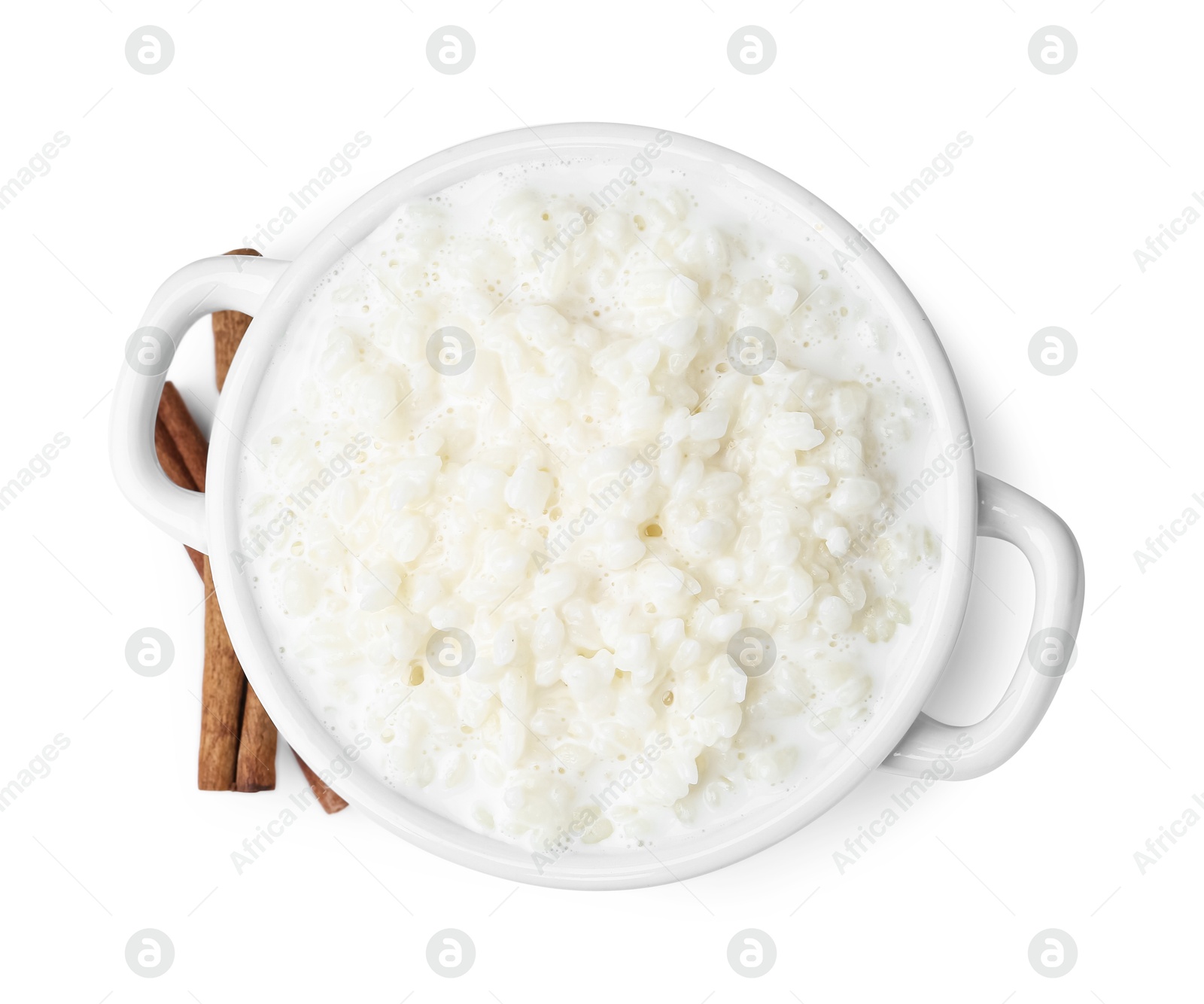 Photo of Delicious rice pudding with cinnamon sticks isolated on white