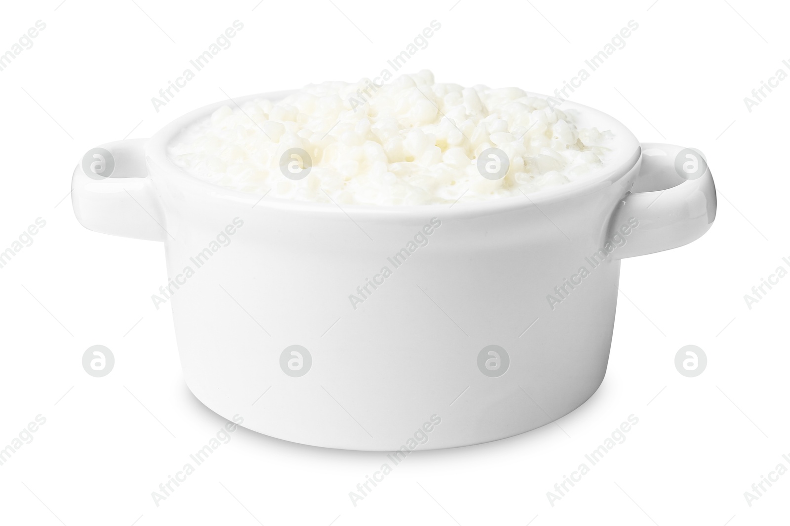 Photo of Delicious rice pudding in ceramic dish isolated on white