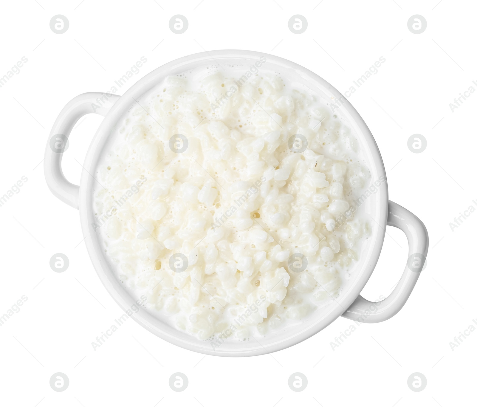 Photo of Delicious rice pudding in ceramic dish isolated on white, top view