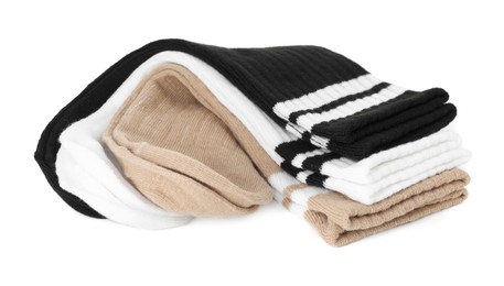 Photo of Pairs of soft socks isolated on white