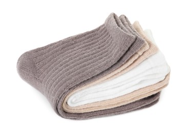 Photo of Pairs of folded soft socks isolated on white