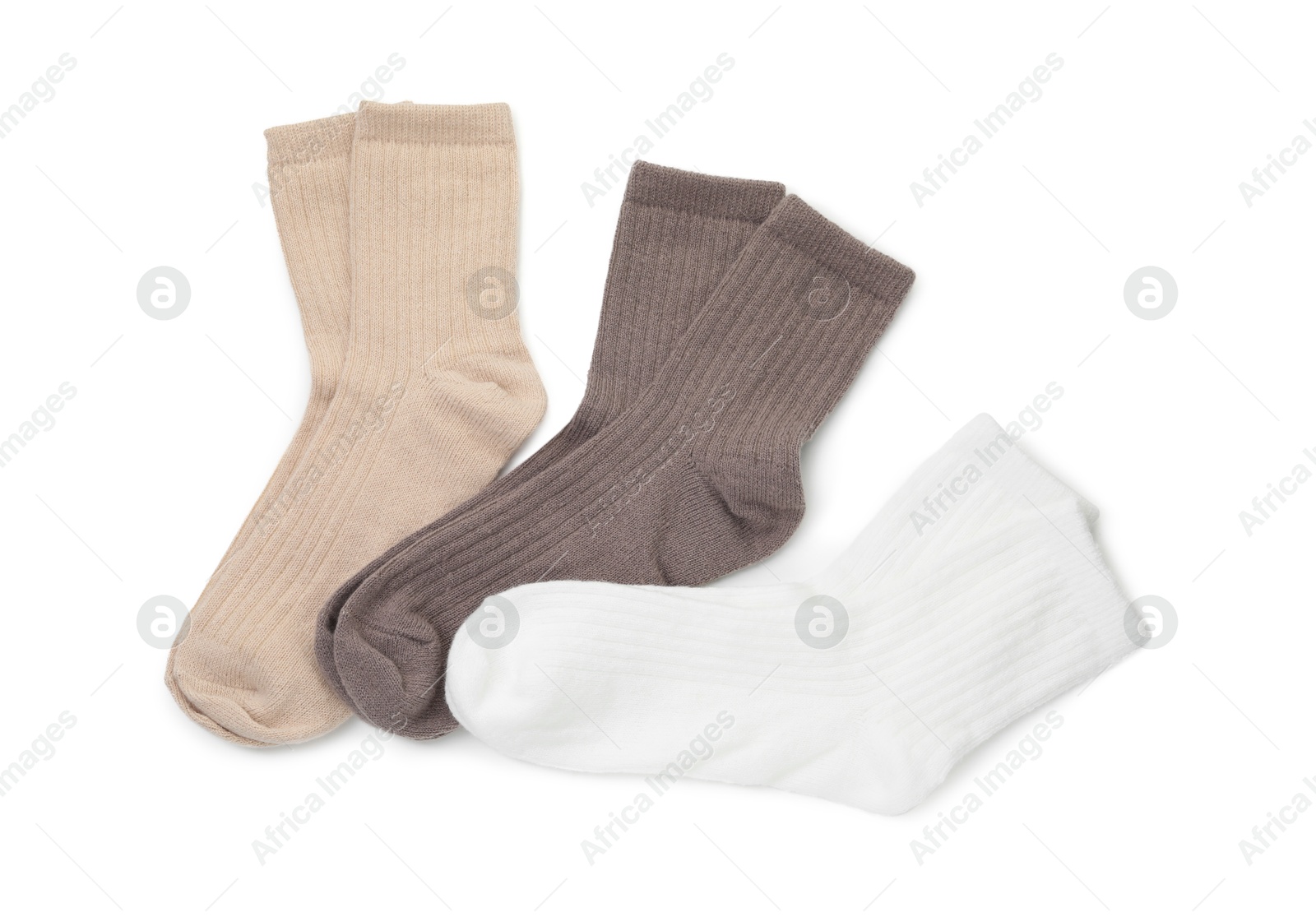 Photo of Pairs of soft socks isolated on white, top view