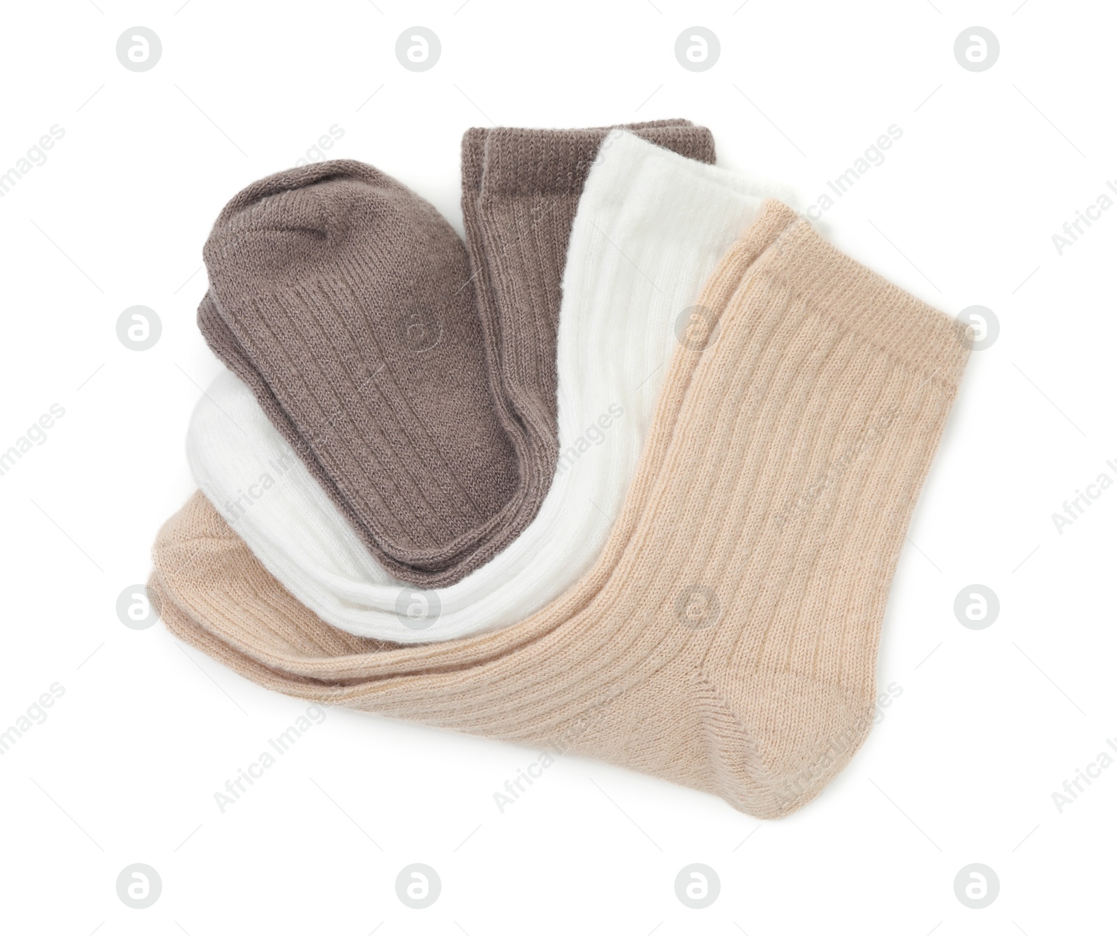 Photo of Pairs of soft socks isolated on white, top view