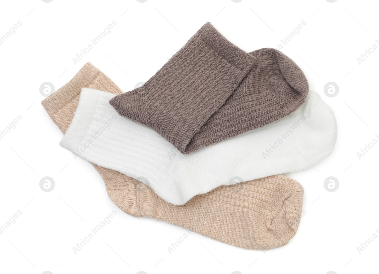 Photo of Pairs of soft socks isolated on white, top view