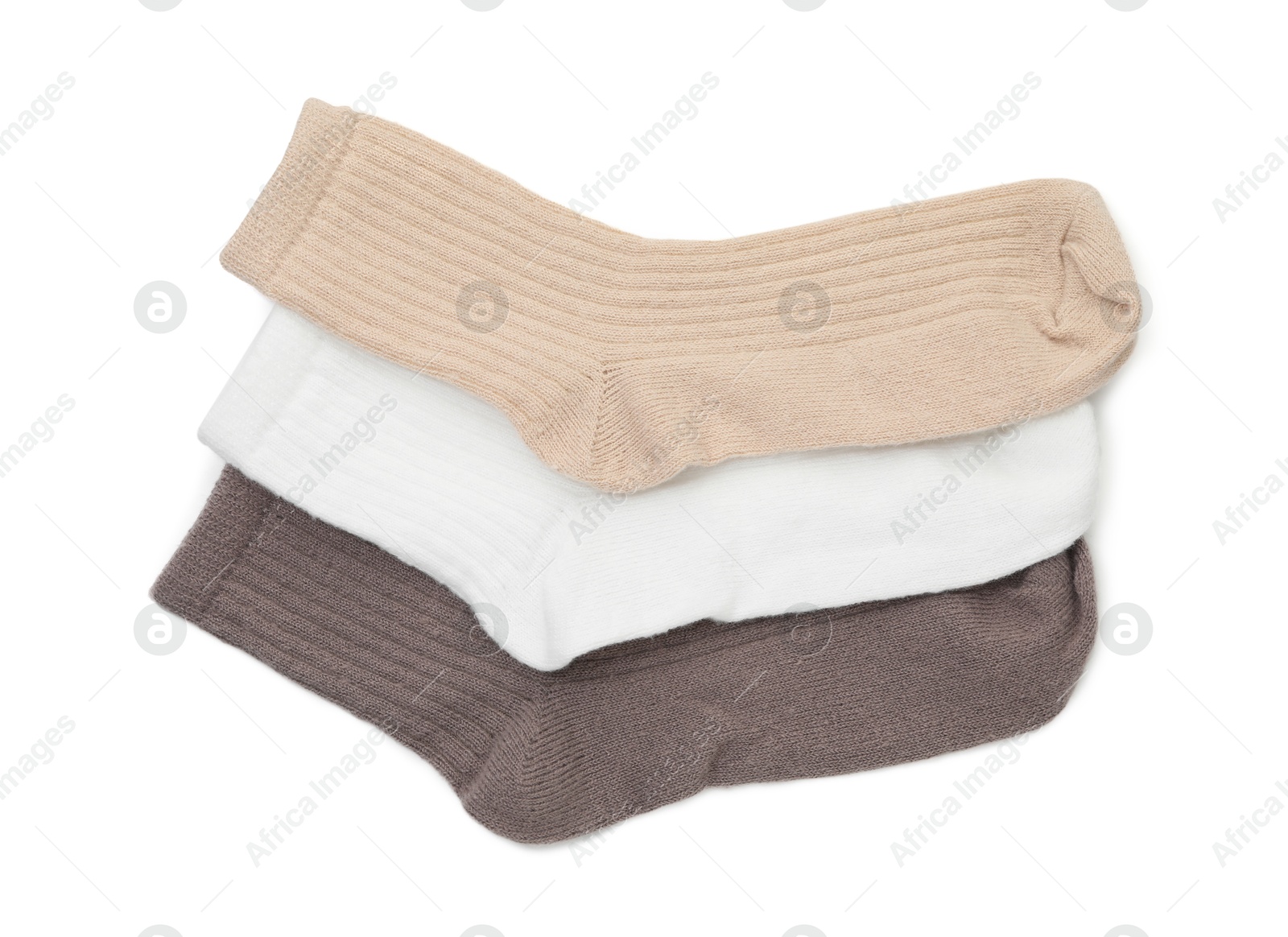 Photo of Pairs of soft socks isolated on white, top view