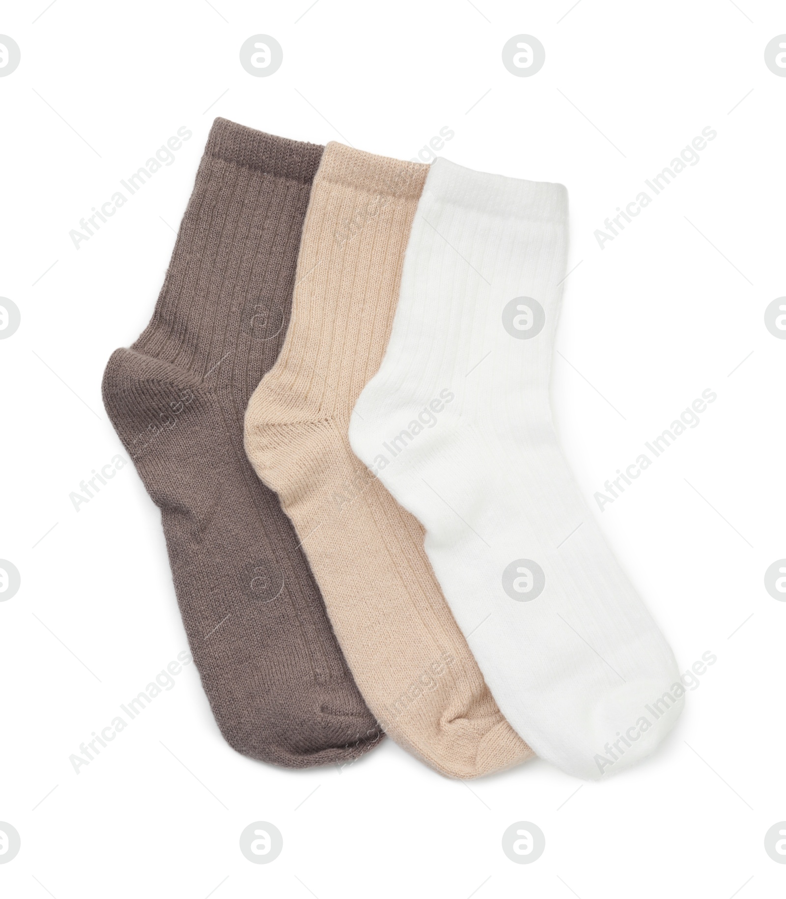 Photo of Pairs of soft socks isolated on white, top view