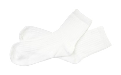 Photo of Pair of soft socks isolated on white, top view