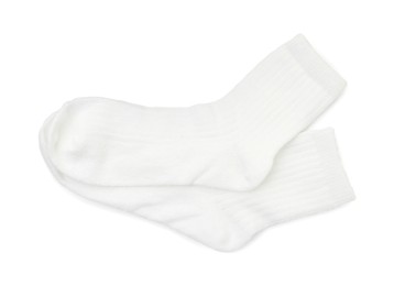 Photo of Pair of soft socks isolated on white, top view