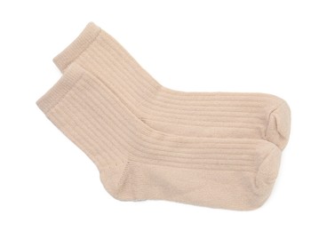 Photo of Pair of soft socks isolated on white, top view