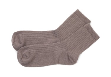 Photo of Pair of soft socks isolated on white, top view