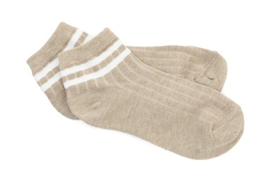 Photo of Pair of soft socks isolated on white, top view