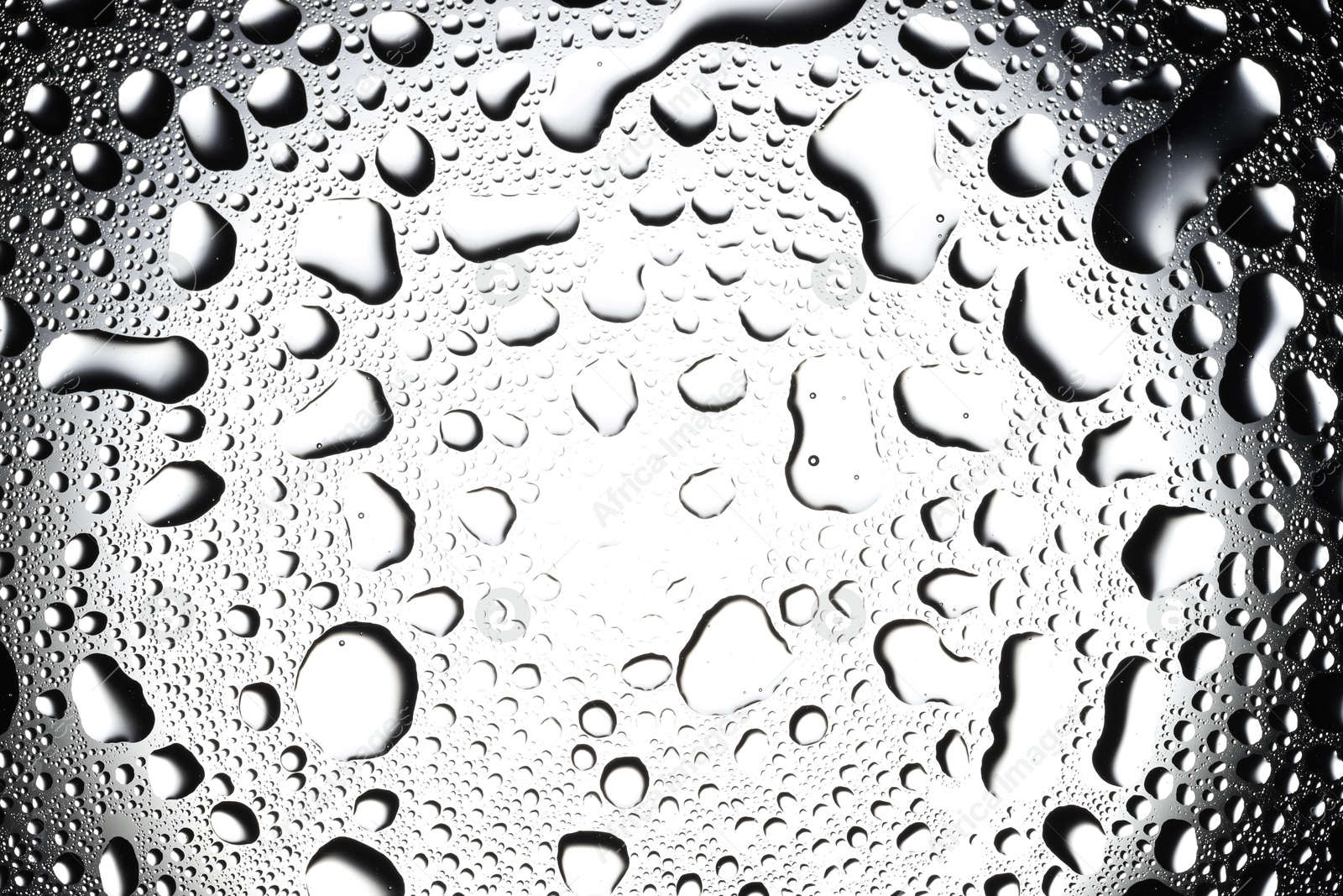 Photo of Water drops on glass surface, top view