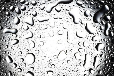 Water drops on glass surface, top view