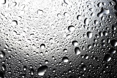 Water drops on glass surface, top view