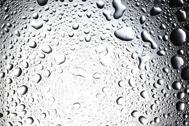 Water drops on glass surface, top view