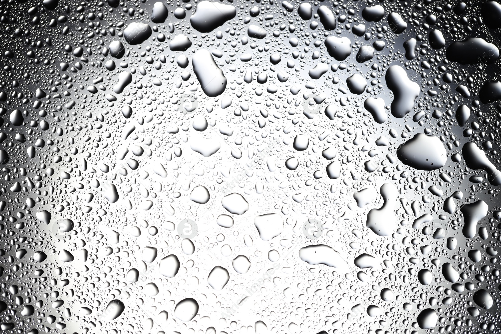 Photo of Water drops on glass surface, top view