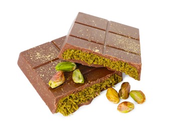 Photo of Pieces of tasty Dubai chocolate with pistachios and knafeh isolated on white