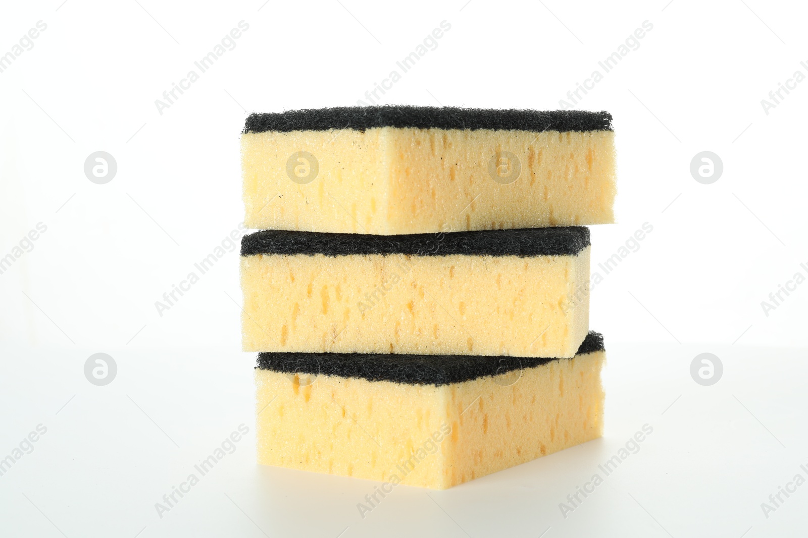 Photo of Stack of yellow sponges isolated on white