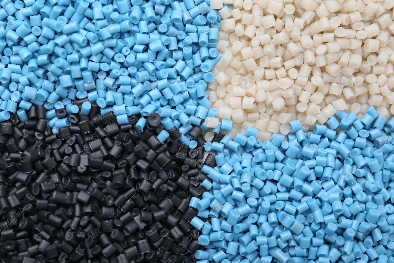 Photo of Pile of colorful plastic granules as background, top view