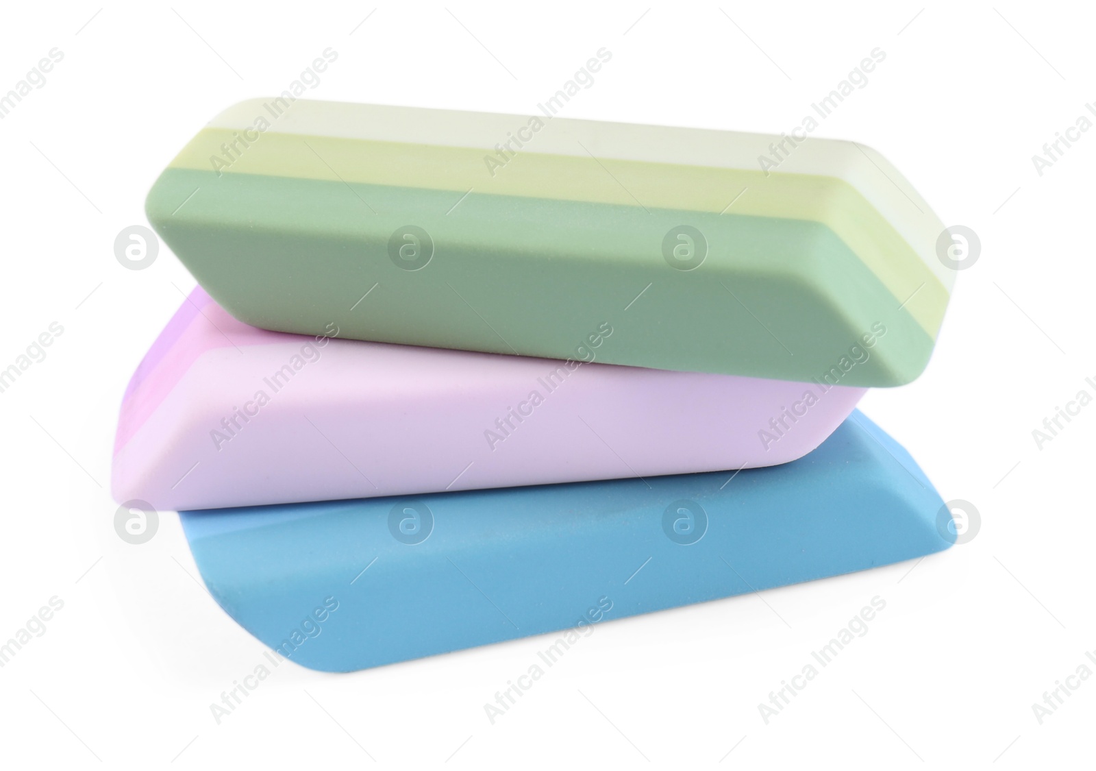 Photo of New bright erasers isolated on white. School stationery