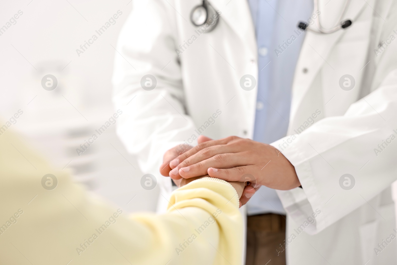 Photo of Healthcare worker supporting patient in hospital, closeup