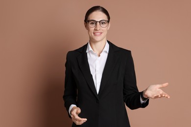 Photo of Portrait of banker in glasses on brown background