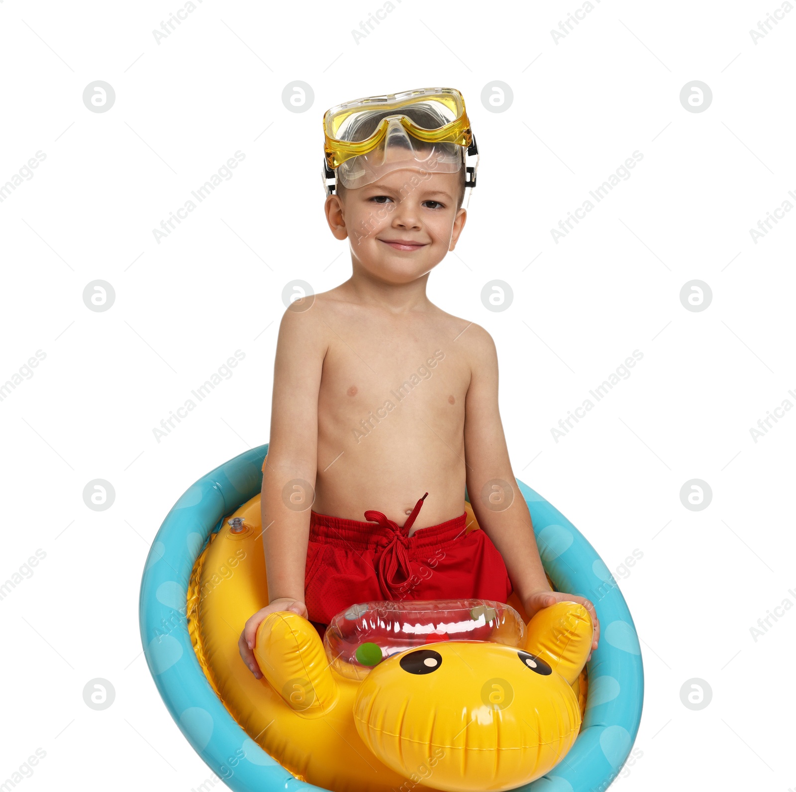 Photo of Cute little boy in beachwear with mask and inflatable ring on white background