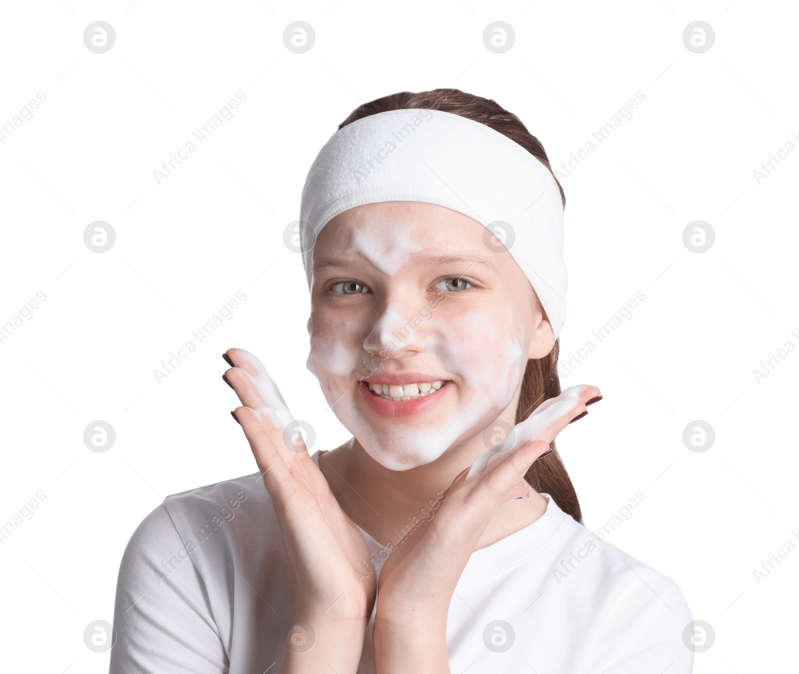 Photo of Teenage girl washing her face with cleanser on white background. Cosmetic product