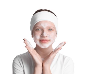 Photo of Teenage girl washing her face with cleanser on white background. Cosmetic product