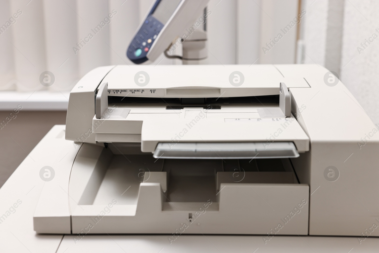 Photo of One modern printer in room, closeup view