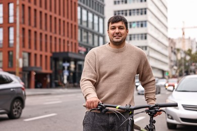 Photo of Man with bicycle outdoors, space for text