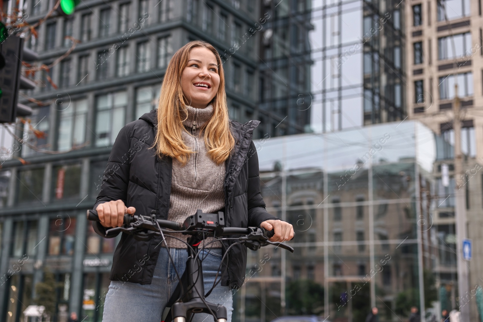 Photo of Woman with bicycle outdoors, low angle view. Space for text