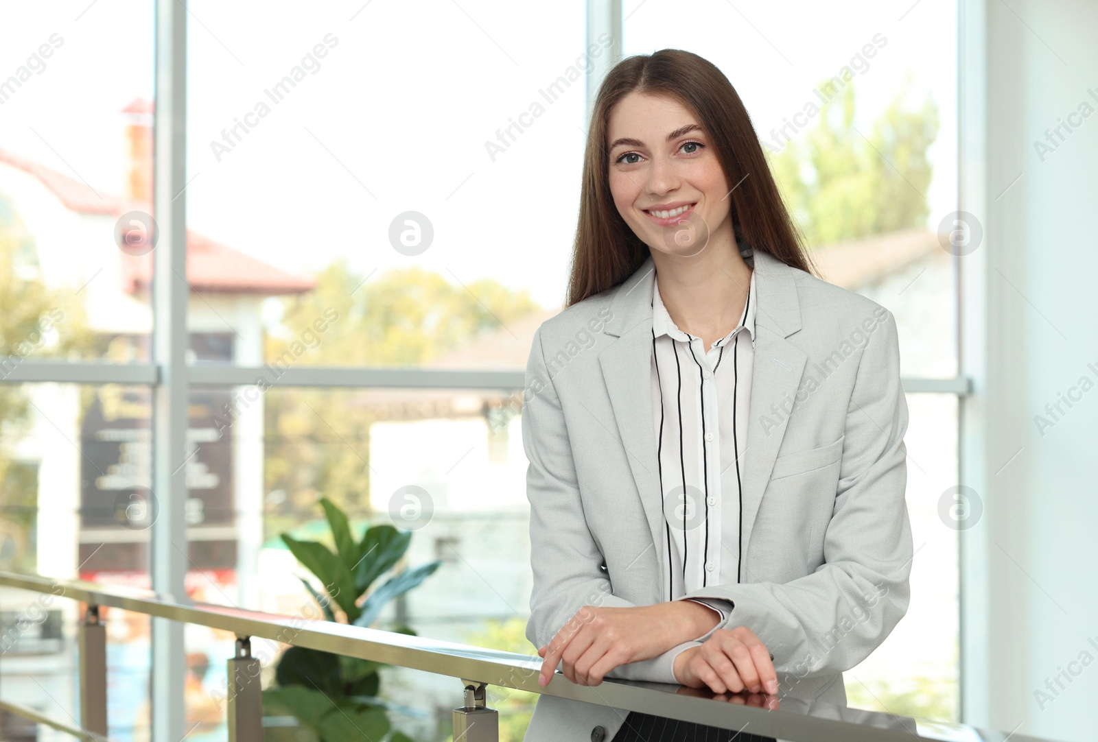 Photo of Portrait of happy banker in jacket indoors. Space for text