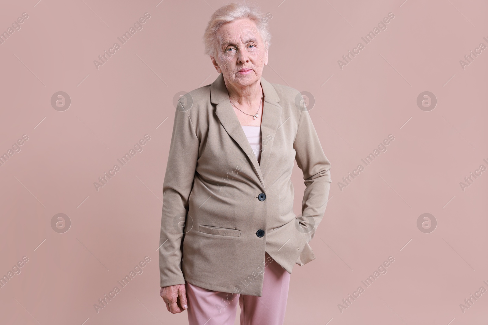 Photo of Portrait of senior woman on color background