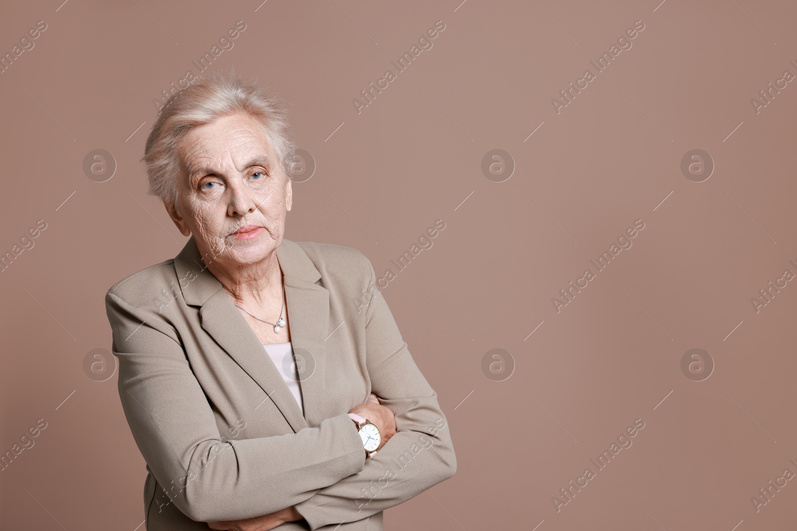 Photo of Portrait of senior woman on color background. Space for text