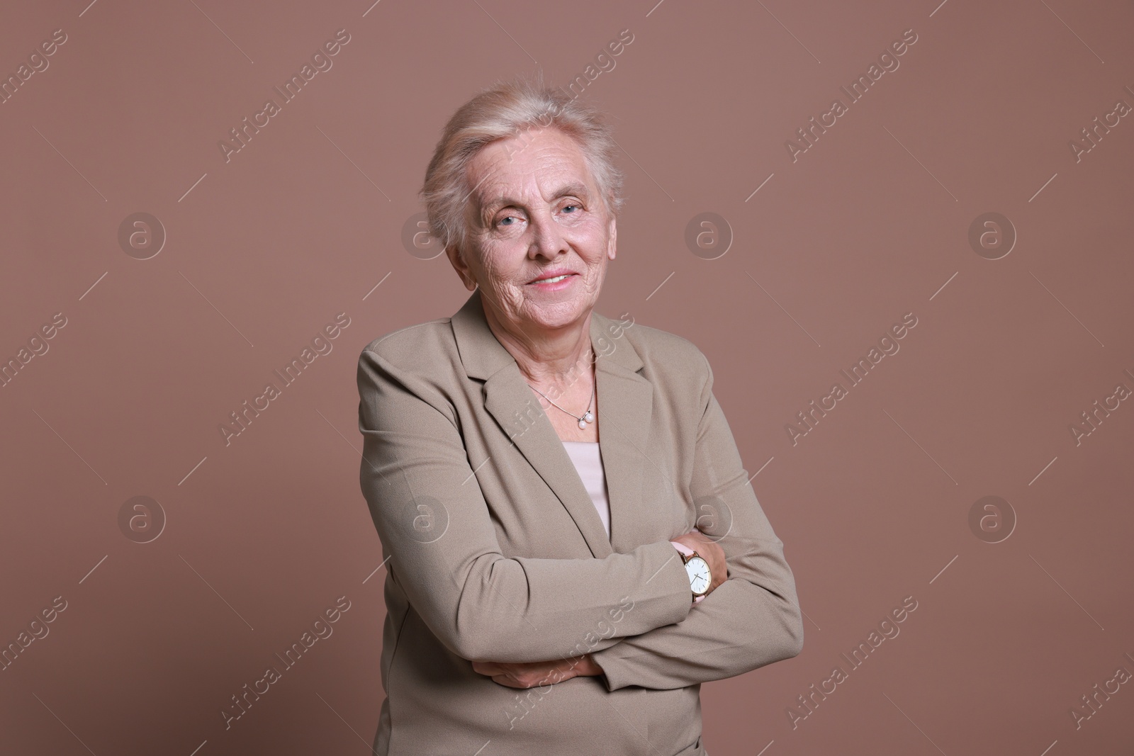 Photo of Portrait of senior woman on color background