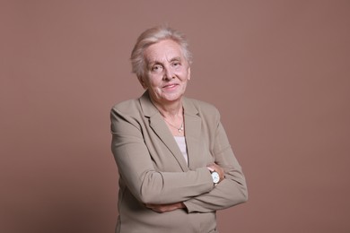 Photo of Portrait of senior woman on color background