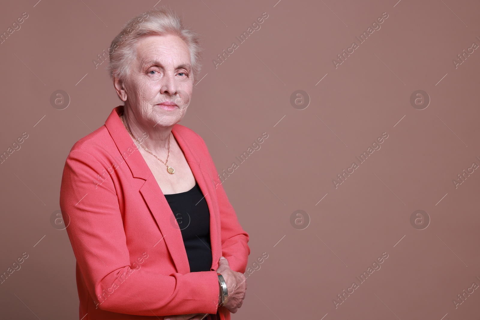 Photo of Portrait of senior woman on color background. Space for text