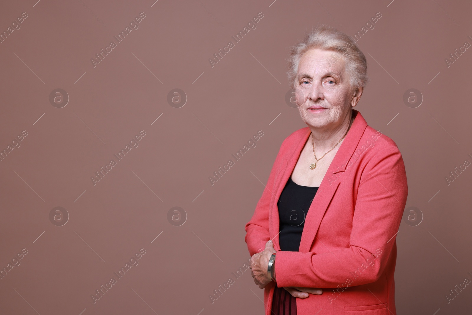 Photo of Portrait of senior woman on color background. Space for text