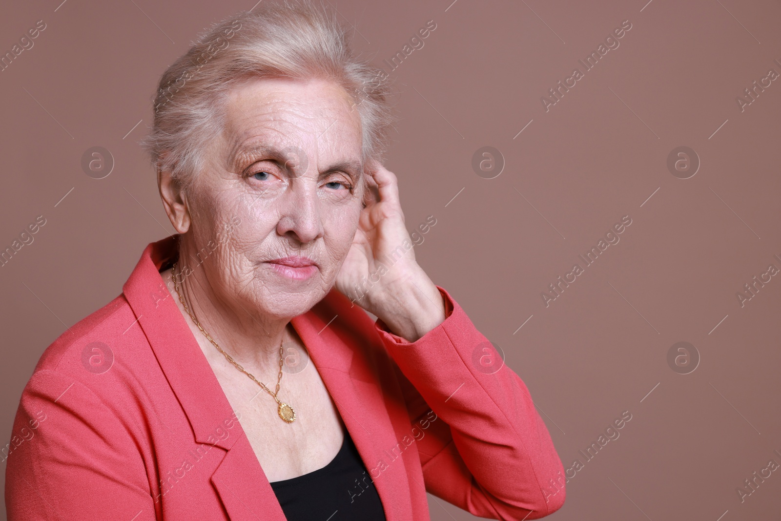 Photo of Portrait of senior woman on color background. Space for text