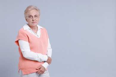 Photo of Portrait of senior woman on light background. Space for text