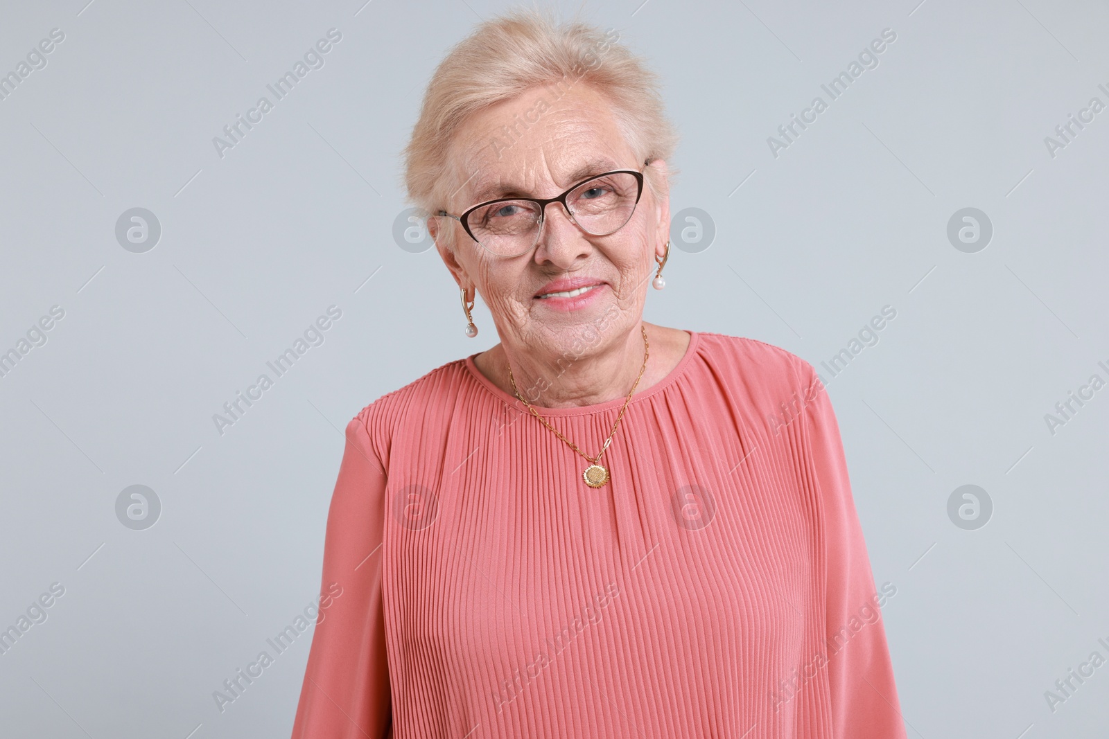 Photo of Portrait of senior woman on light background