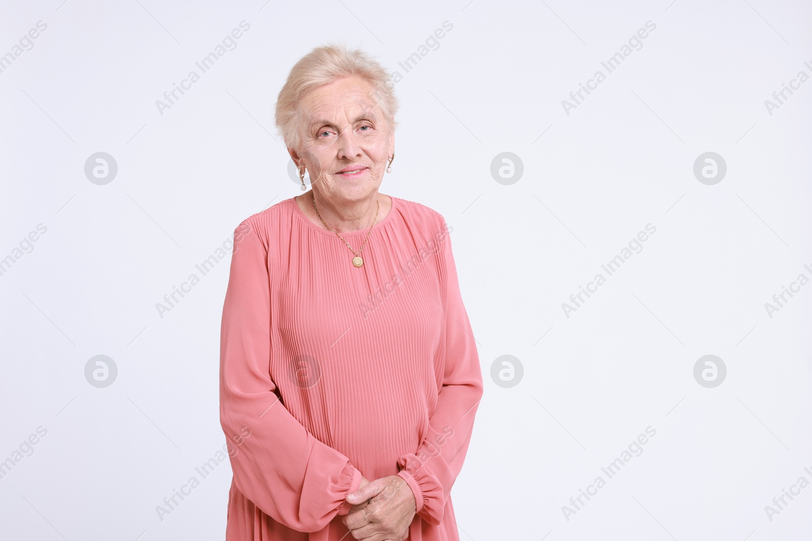 Photo of Portrait of senior woman on white background. Space for text