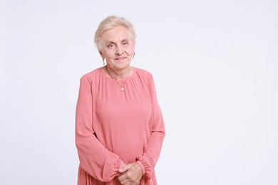 Photo of Portrait of senior woman on white background. Space for text