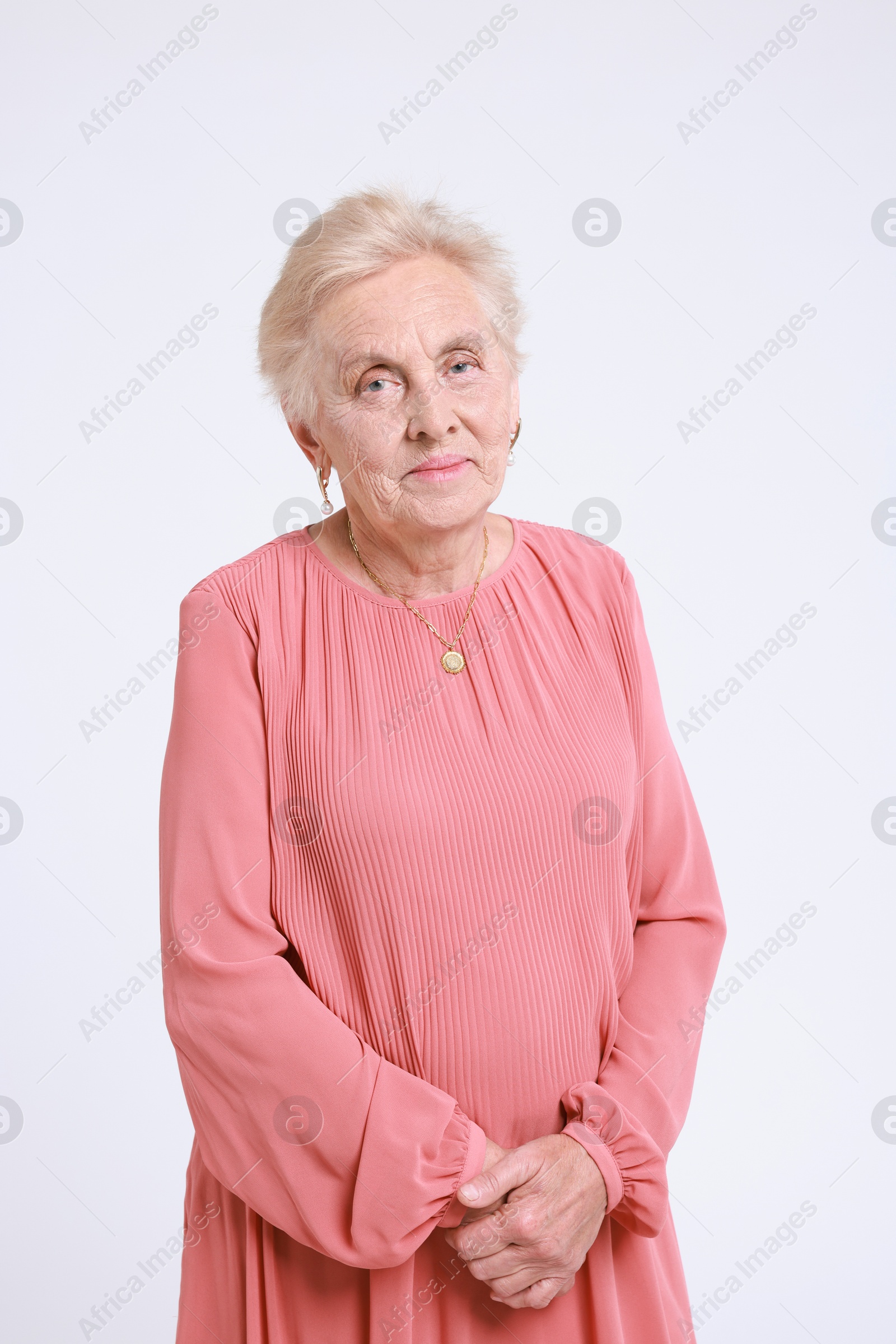 Photo of Portrait of senior woman on white background